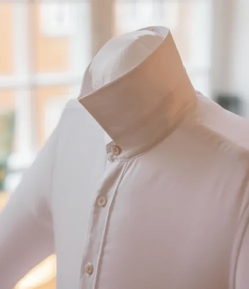 Shirt collar folded up on an automatic ironing machine
